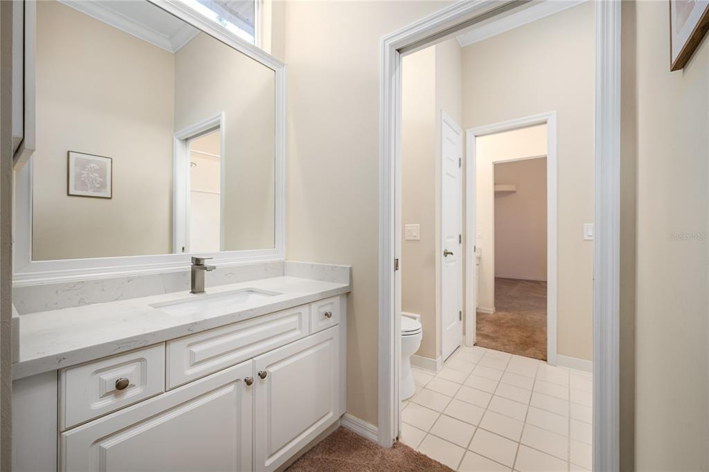 4417 Southwest 91st Drive Gainesville, FL 32608 - Photo 37 of 54 a bathroom with a sink and a mirror
