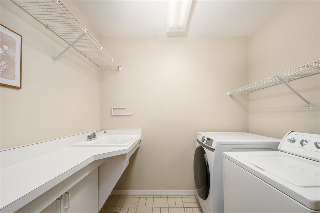 4417 Southwest 91st Drive Gainesville, FL 32608 - Photo 39 of 54 a view of bathroom with a sink and washer