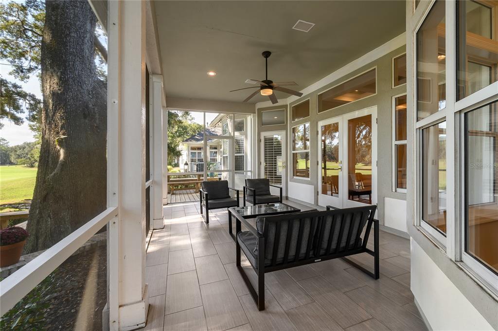 4417 Southwest 91st Drive Gainesville, FL 32608 - Photo 42 of 54 a balcony with furniture and a potted plant