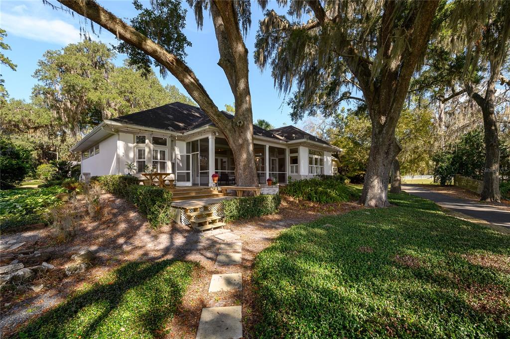 4417 Southwest 91st Drive Gainesville, FL 32608 - Photo 46 of 54 a front view of a house with yard and green space