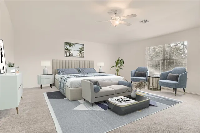 a bedroom with furniture and a window