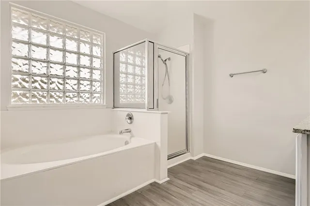 a white bath tub sitting next to a window