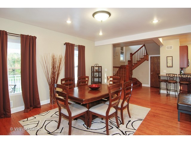 238 Lionel Road Riverside, IL 60546 - Photo 13 of 24 a dining room with furniture and wooden floor