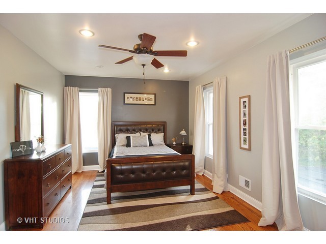 238 Lionel Road Riverside, IL 60546 - Photo 16 of 24 a bedroom with a bed mirror and a window