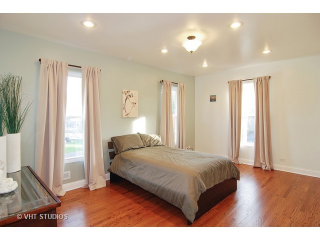 238 Lionel Road Riverside, IL 60546 - Photo 18 of 24 a bedroom with a bed and a large window