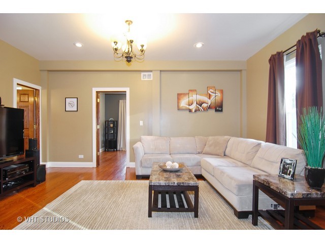 238 Lionel Road Riverside, IL 60546 - Photo 6 of 24 a living room with furniture a dining table and a flat screen tv