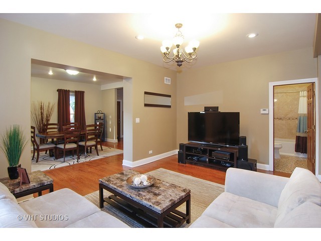 238 Lionel Road Riverside, IL 60546 - Photo 7 of 24 a living room with furniture and a flat screen tv