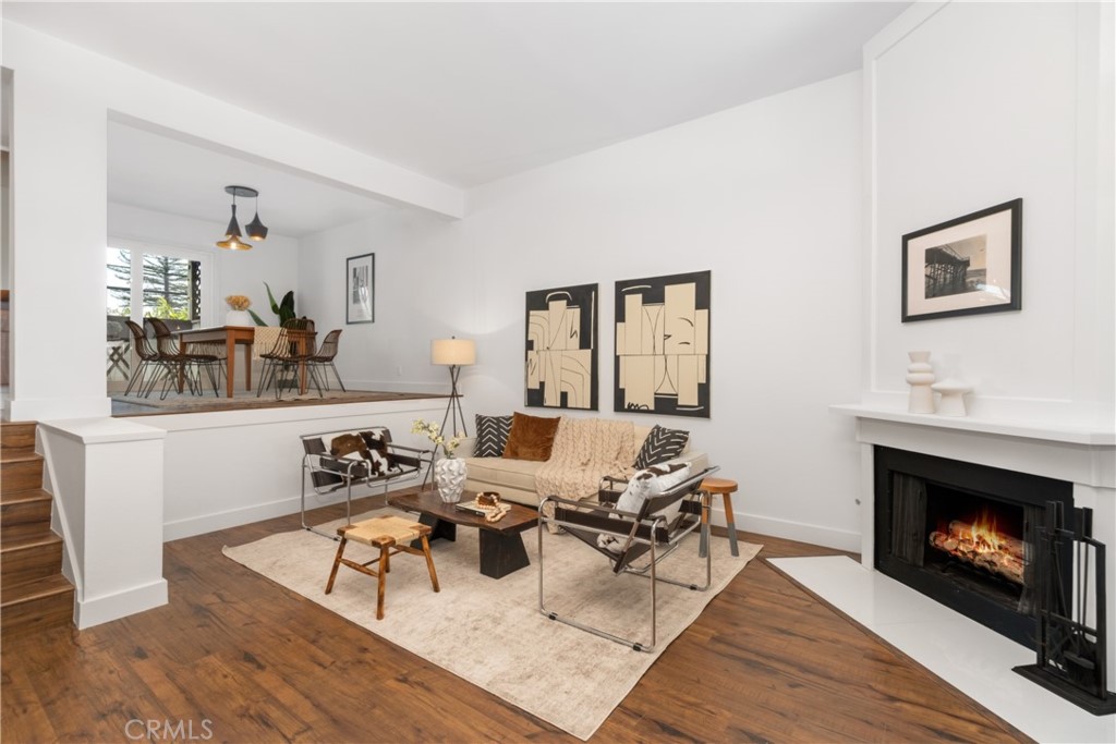 11848 Erwin Street, Unit 5 North Hollywood, CA 91606 - Photo 1 of 1 a living room with furniture and a fireplace