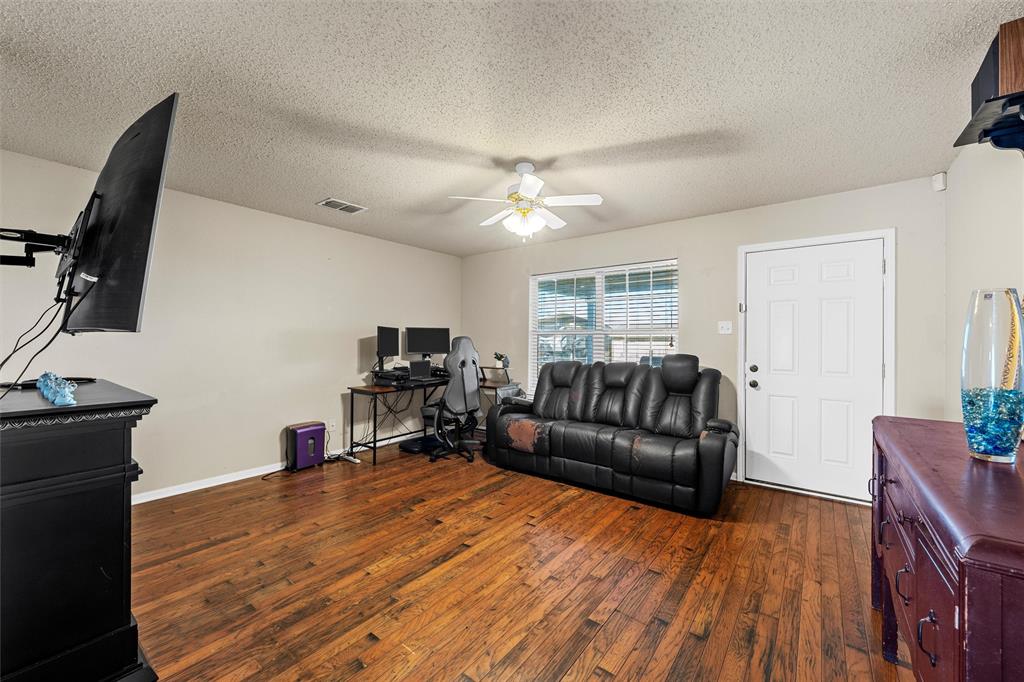494 Westgate I Road Eddy, TX 76524 - Photo 20 of 34 Office space featuring dark wood-style flooring, a textured ceiling, and ceiling fan