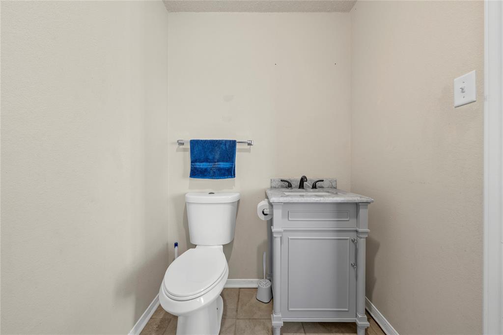 494 Westgate I Road Eddy, TX 76524 - Photo 23 of 34 Half bathroom featuring vanity and light tile patterned flooring