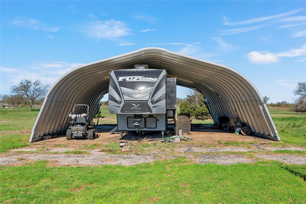494 Westgate I Road Eddy, TX 76524 - Photo 26 of 34 View of parking featuring a carport