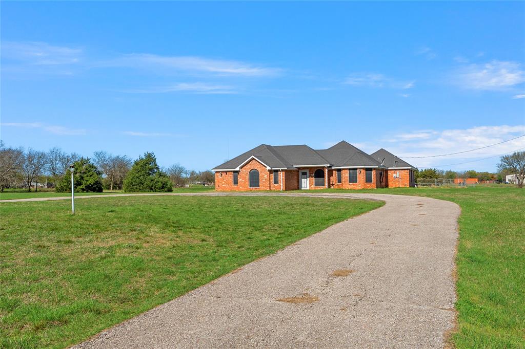 494 Westgate I Road Eddy, TX 76524 - Photo 5 of 34 View of front of house with a front yard, driveway, and brick siding