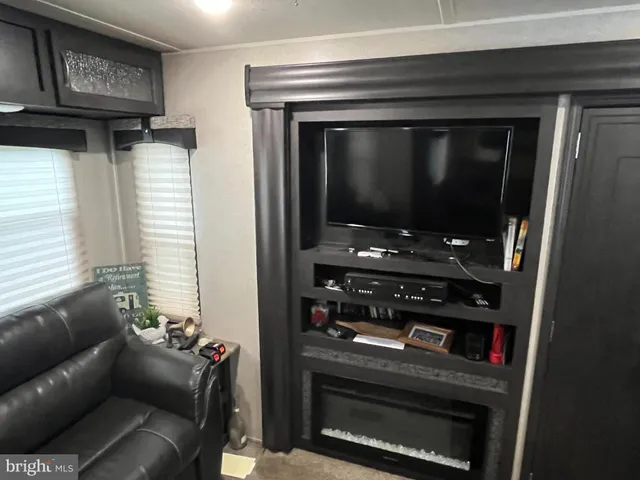 a view of backyard with a car parked