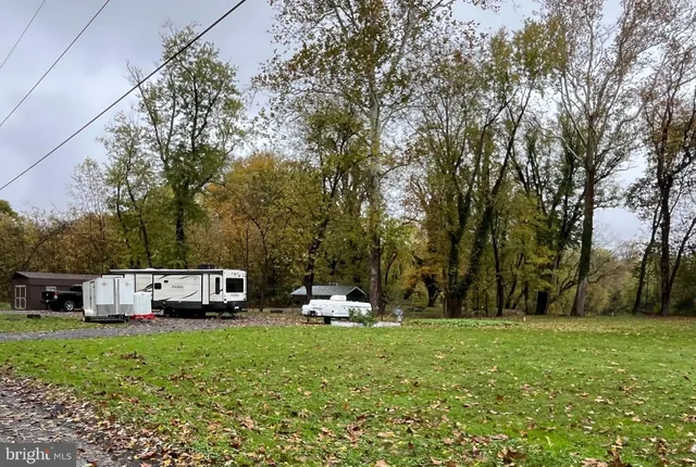 a house view with a sitting space and garden