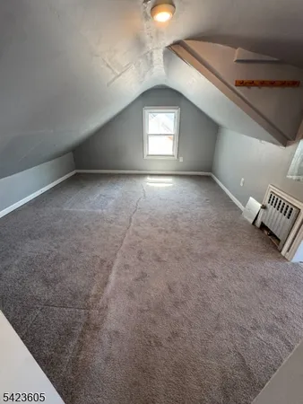 a view of wooden floor and windows in a room
