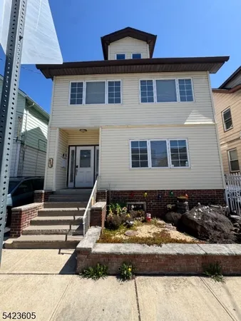 a front view of a house with entertaining space