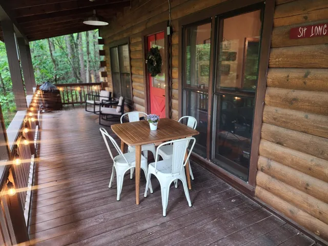 a dining room with furniture window and wooden floor