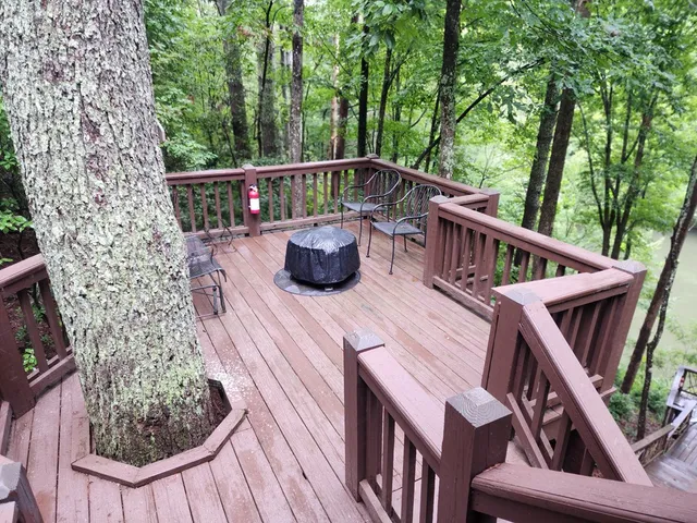 a view of a chairs and table on the deck