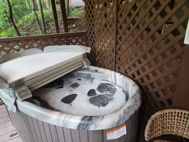 a view of a balcony with wooden floor and outdoor seating