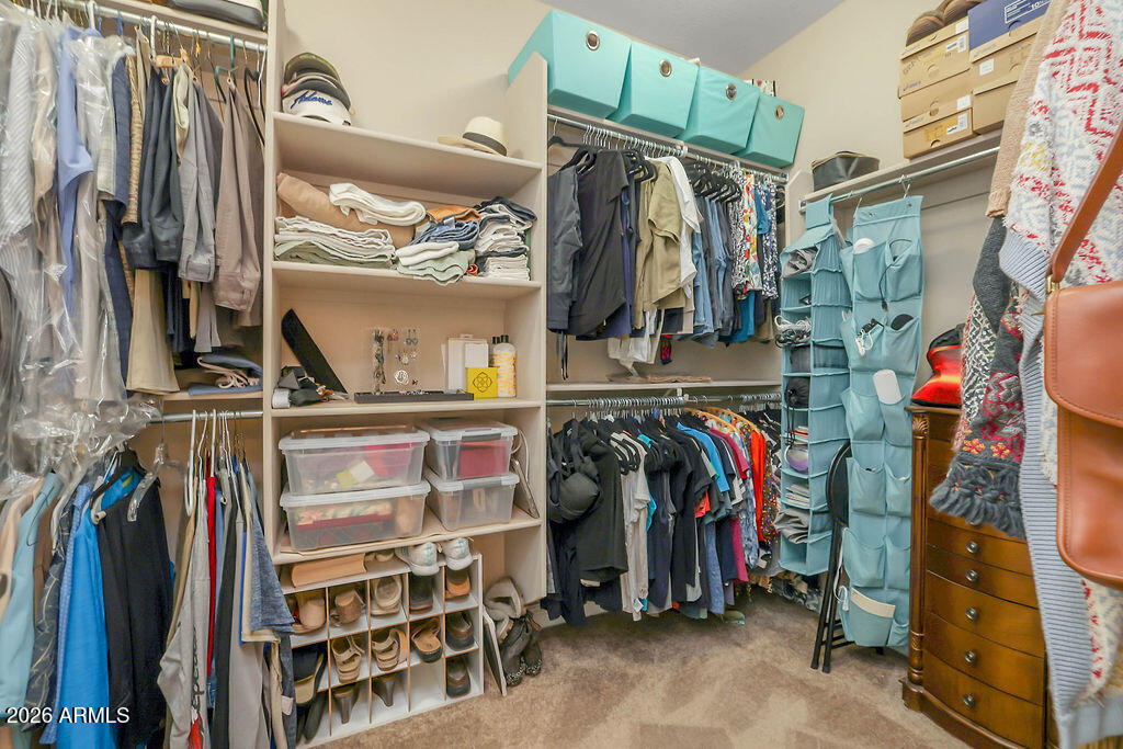 2523 East Nancy Lane Phoenix, AZ 85042 - Photo 21 of 48 a view of walk in closet with clothes and shoes