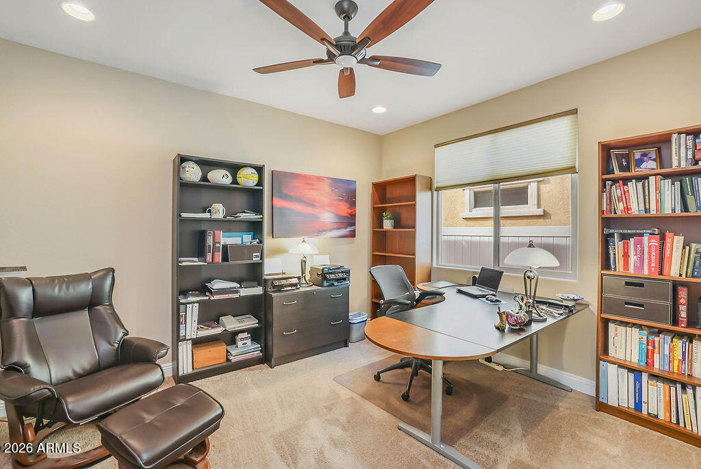 2523 East Nancy Lane Phoenix, AZ 85042 - Photo 22 of 48 a living room with furniture a rug and a bookshelf