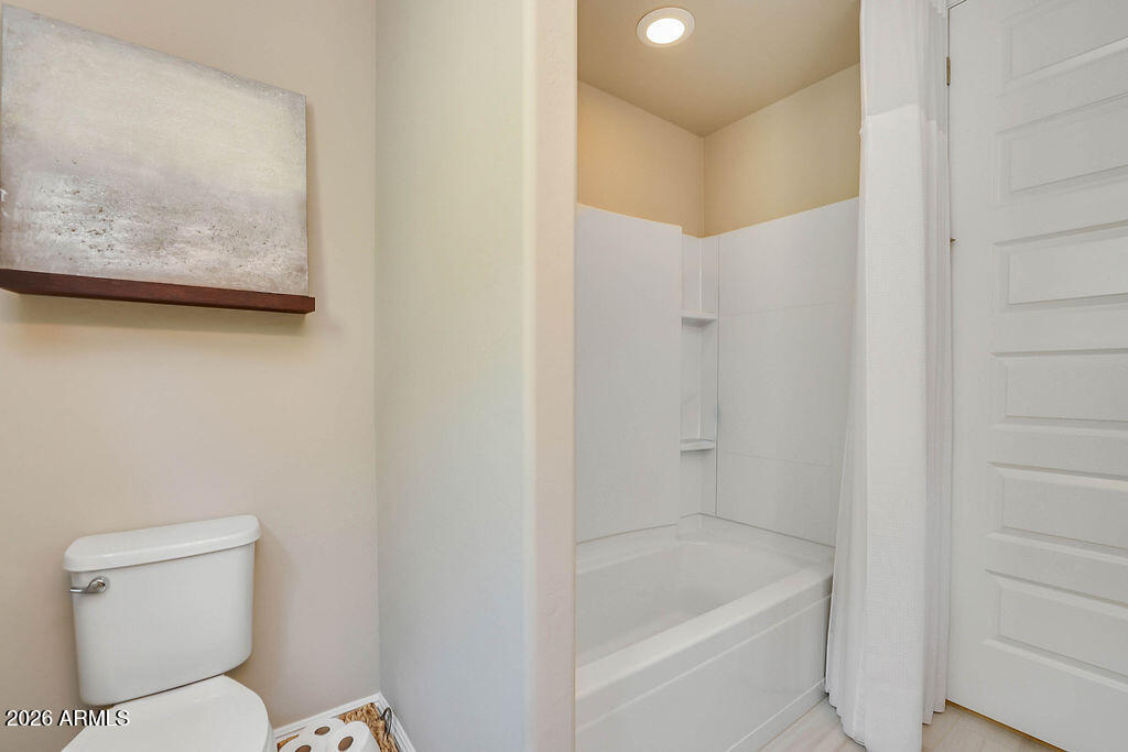 2523 East Nancy Lane Phoenix, AZ 85042 - Photo 25 of 48 a bathroom with a toilet and a bathtub