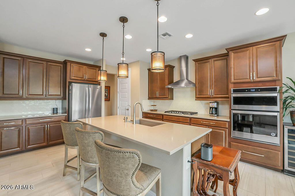 2523 East Nancy Lane Phoenix, AZ 85042 - Photo 8 of 48 a kitchen with stainless steel appliances granite countertop a stove top oven a sink refrigerator and cabinets