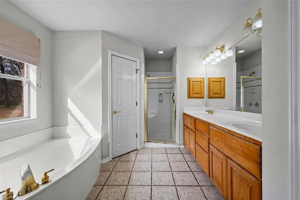 a bathroom with a sink a mirror and a bathtub
