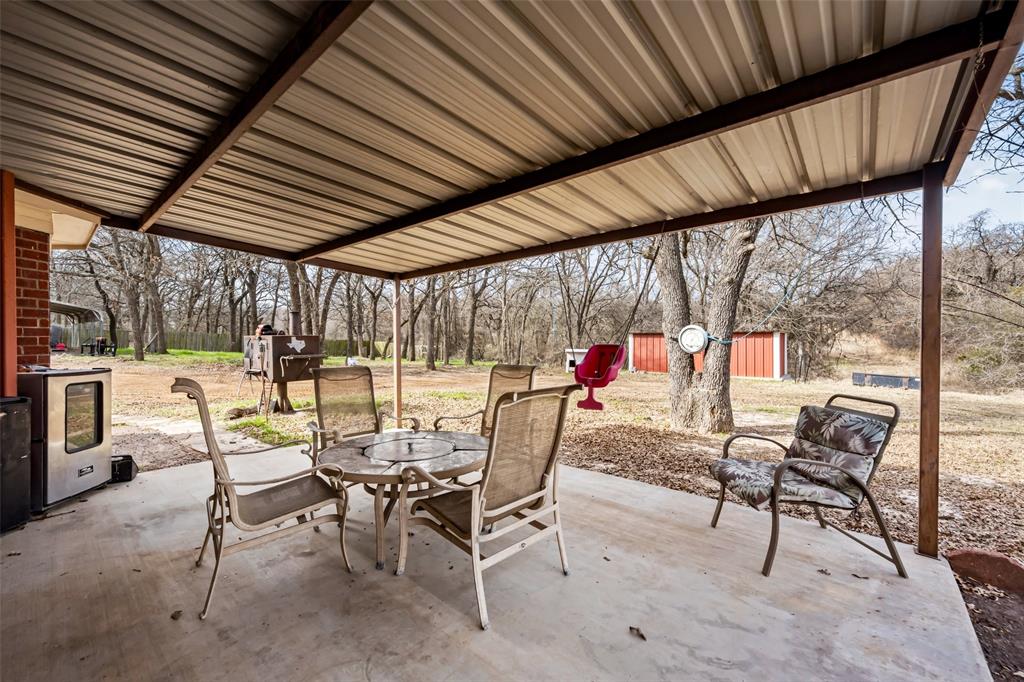 7698 Farm To Market 920 Poolville, TX 76487 - Photo 26 of 37 a view of an outdoor space with seating area