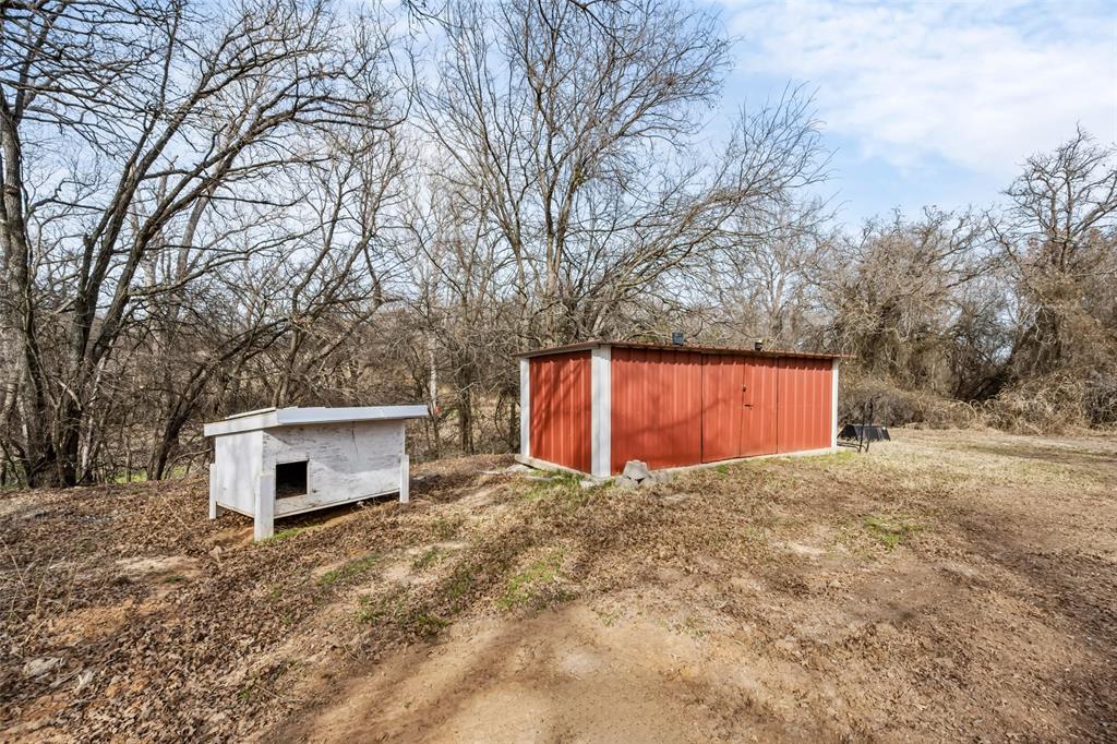 7698 Farm To Market 920 Poolville, TX 76487 - Photo 27 of 37 a view of a outdoor space with trees