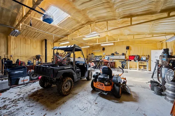 a view of a garage with parked cars