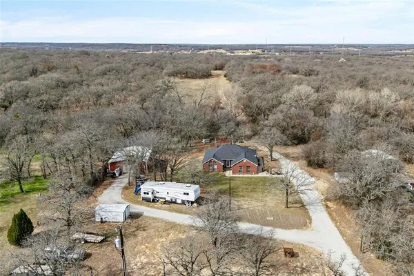 an aerial view of a house with mountain view