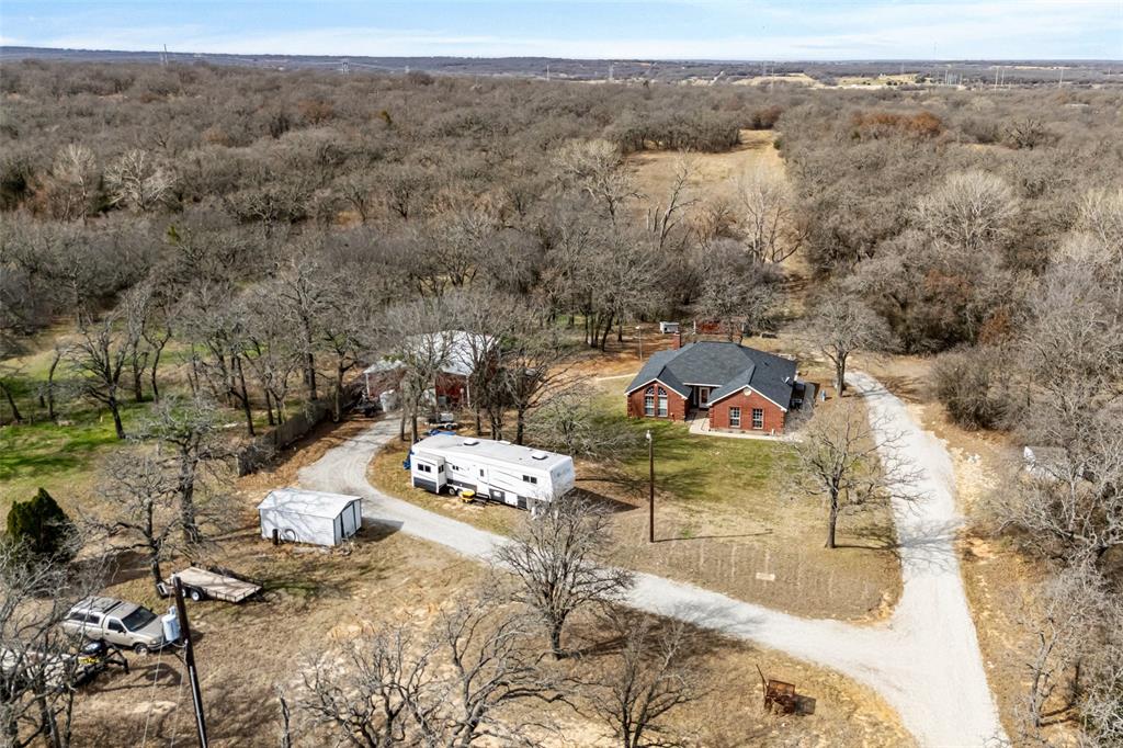 7698 Farm To Market 920 Poolville, TX 76487 - Photo 35 of 37 an aerial view of a house with a yard