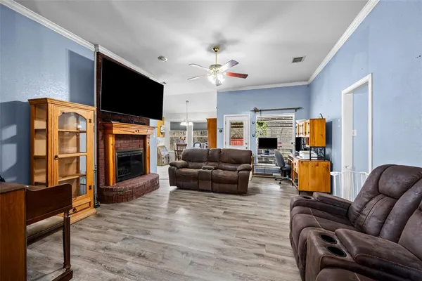 a living room with furniture fireplace and flat screen tv
