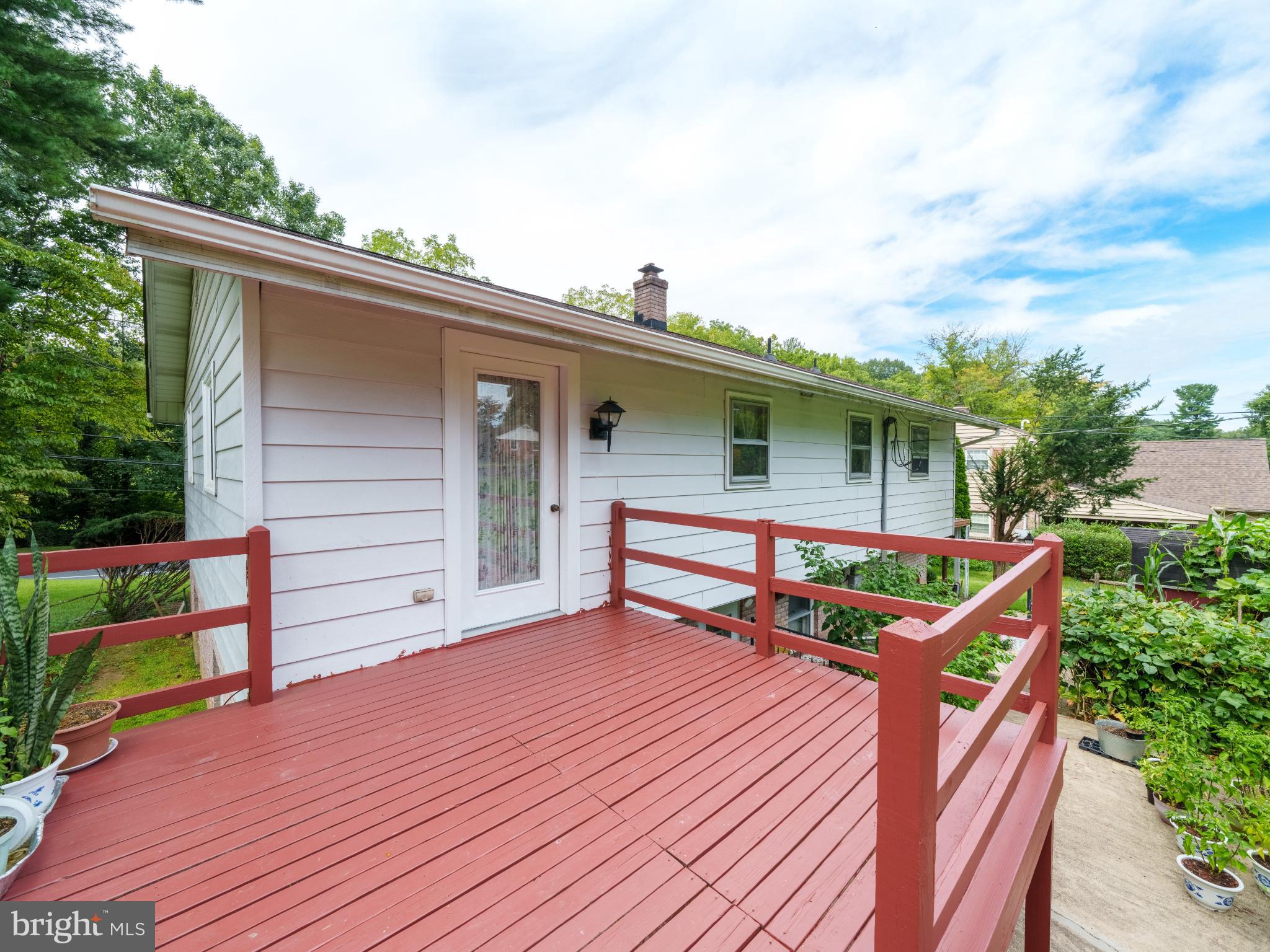 105 School House Road Lancaster, PA 17603 - Photo 21 of 33 Charming deck with lush greenery backdrop.