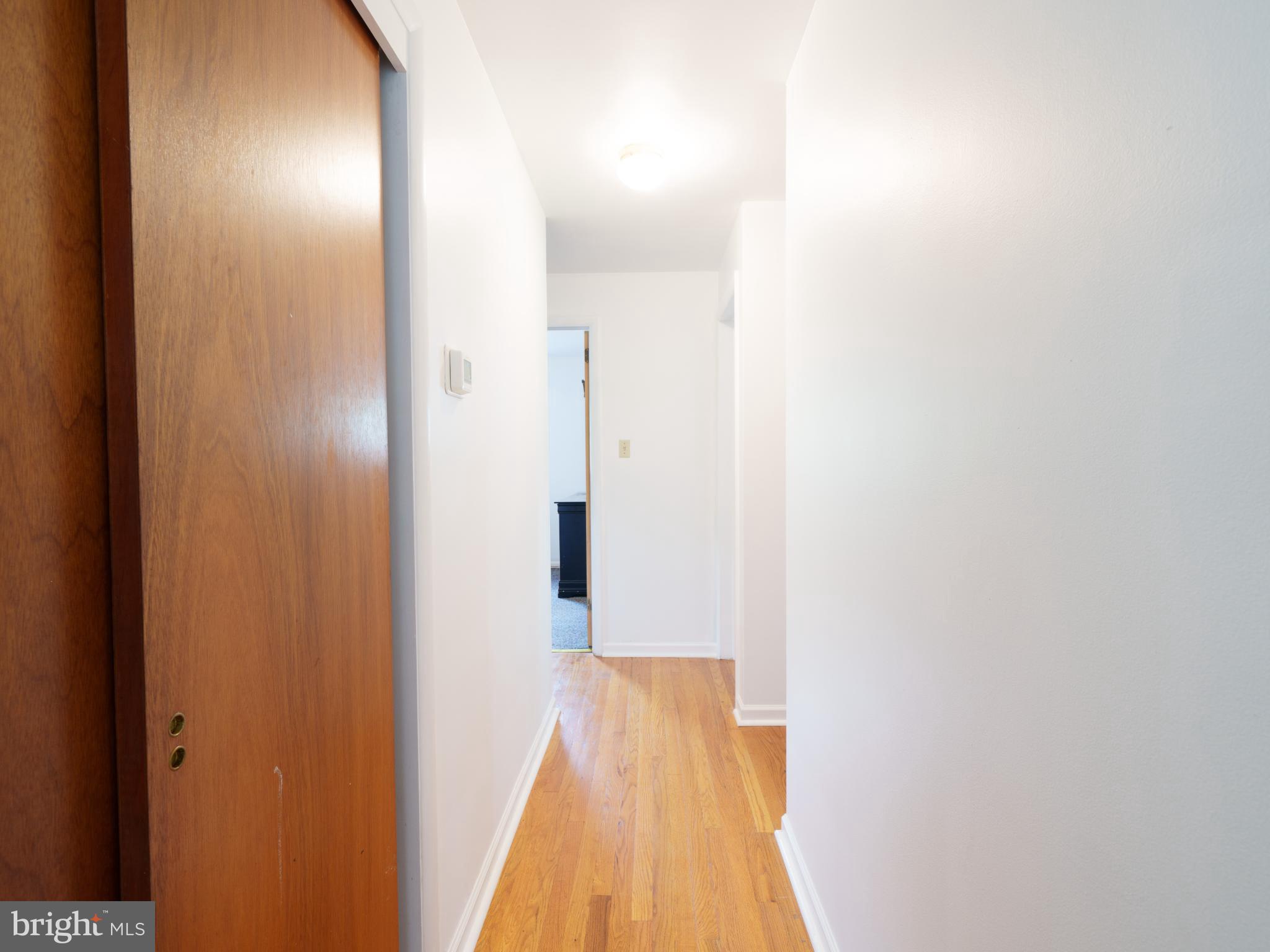 105 School House Road Lancaster, PA 17603 - Photo 10 of 33 Bright and inviting hallway with hardwood floors.