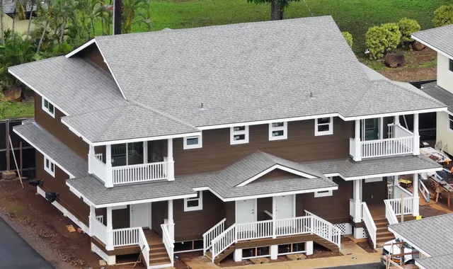 a aerial view of a house with a yard