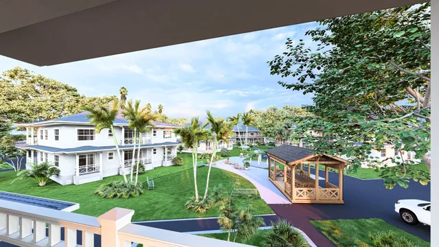 a view of a white house with a big yard and large trees