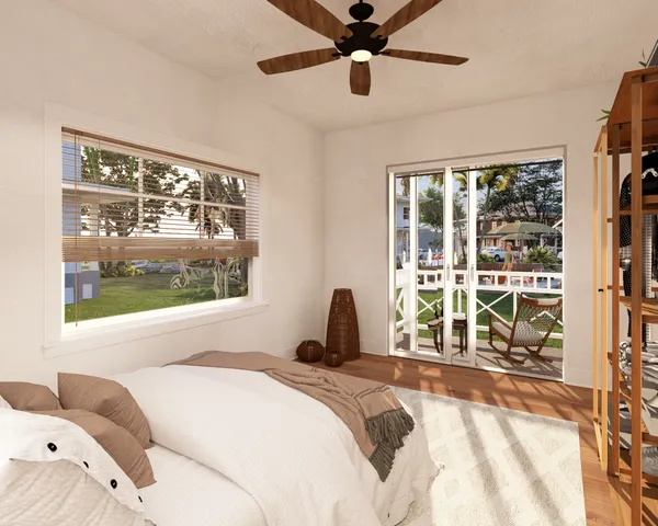 a bedroom with a large bed and a large window