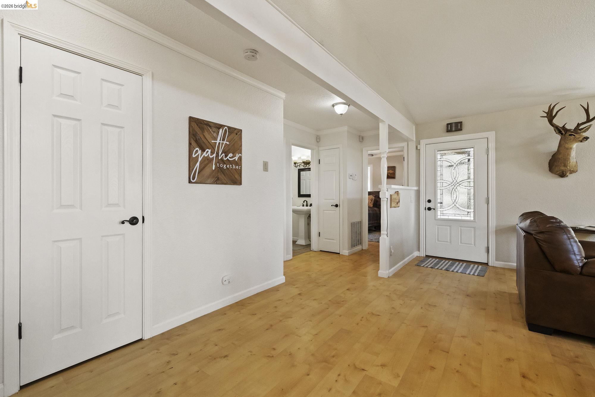 19369 Ferretti Road Groveland, CA 95321 - Photo 15 of 45 Entryway featuring light wood-type flooring and ornamental molding