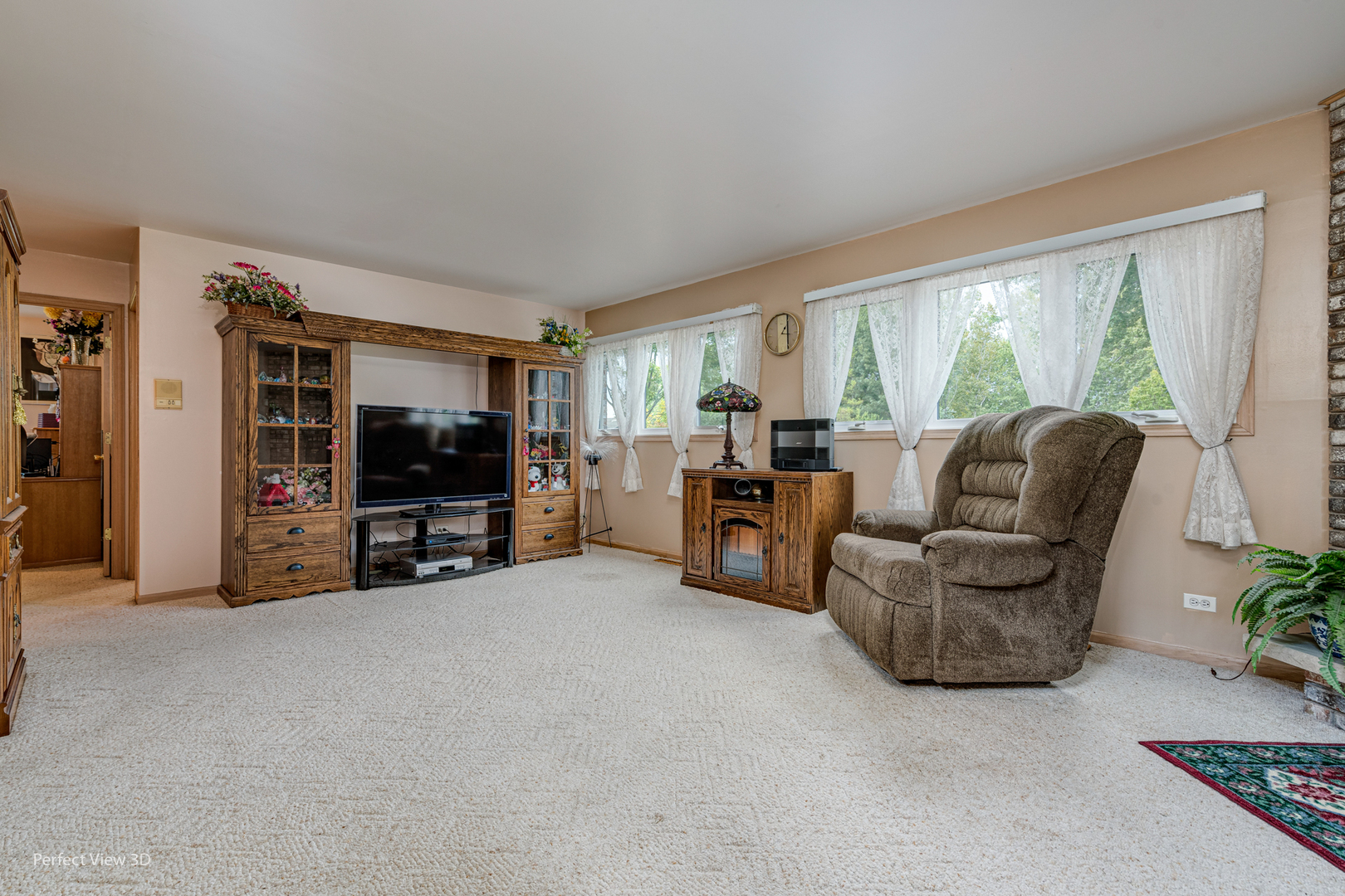 915 Harmoni Lane New Lenox, IL 60451 - Photo 25 of 38 a living room with furniture and a flat screen tv