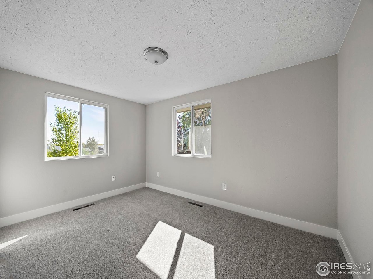 829 Independence Drive Longmont, CO 80504 - Photo 25 of 31 Bedroom 3 with new paint and carpet