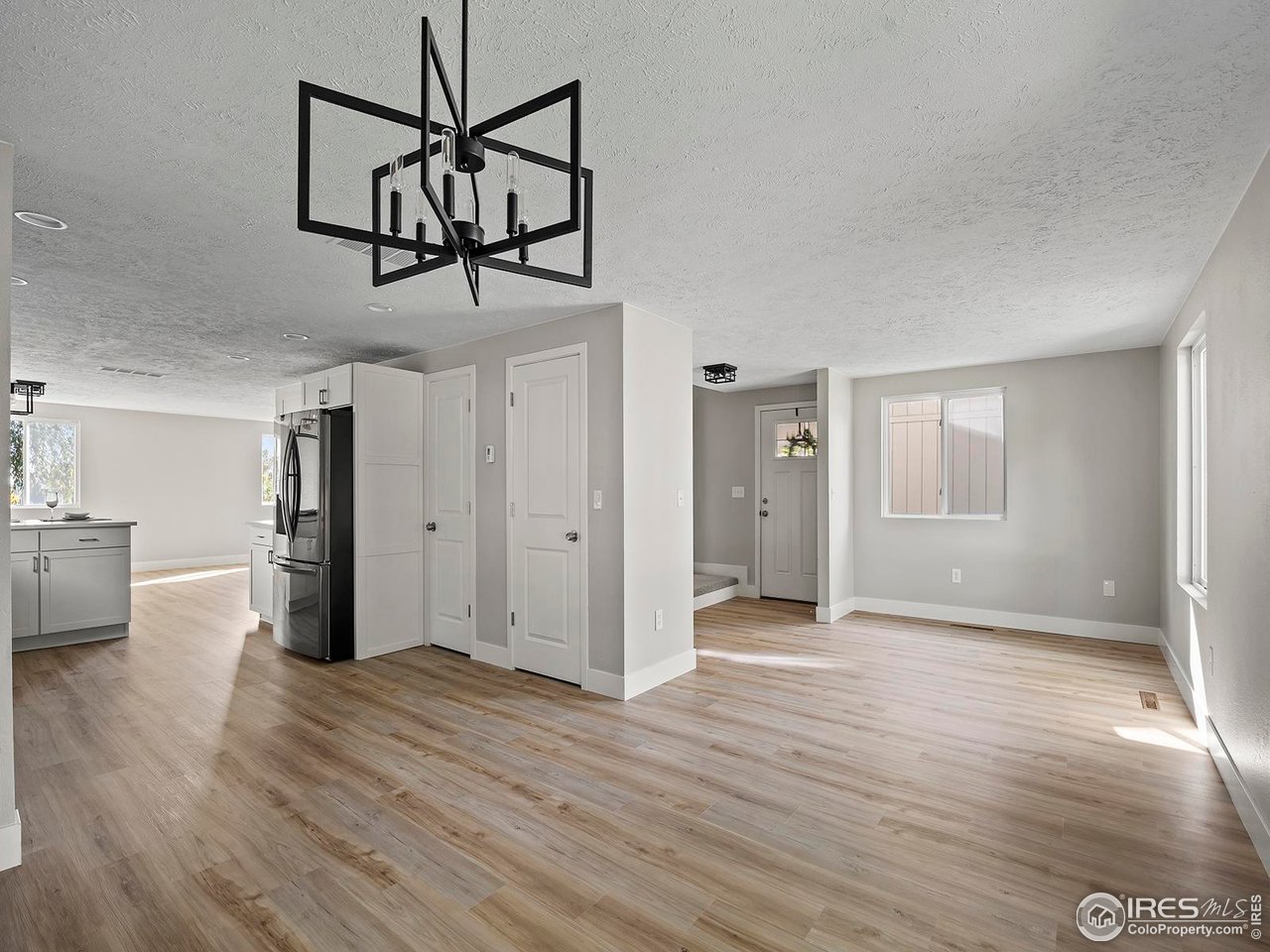 829 Independence Drive Longmont, CO 80504 - Photo 6 of 31 Open concept flows from entryway, to dining area, to kitchen