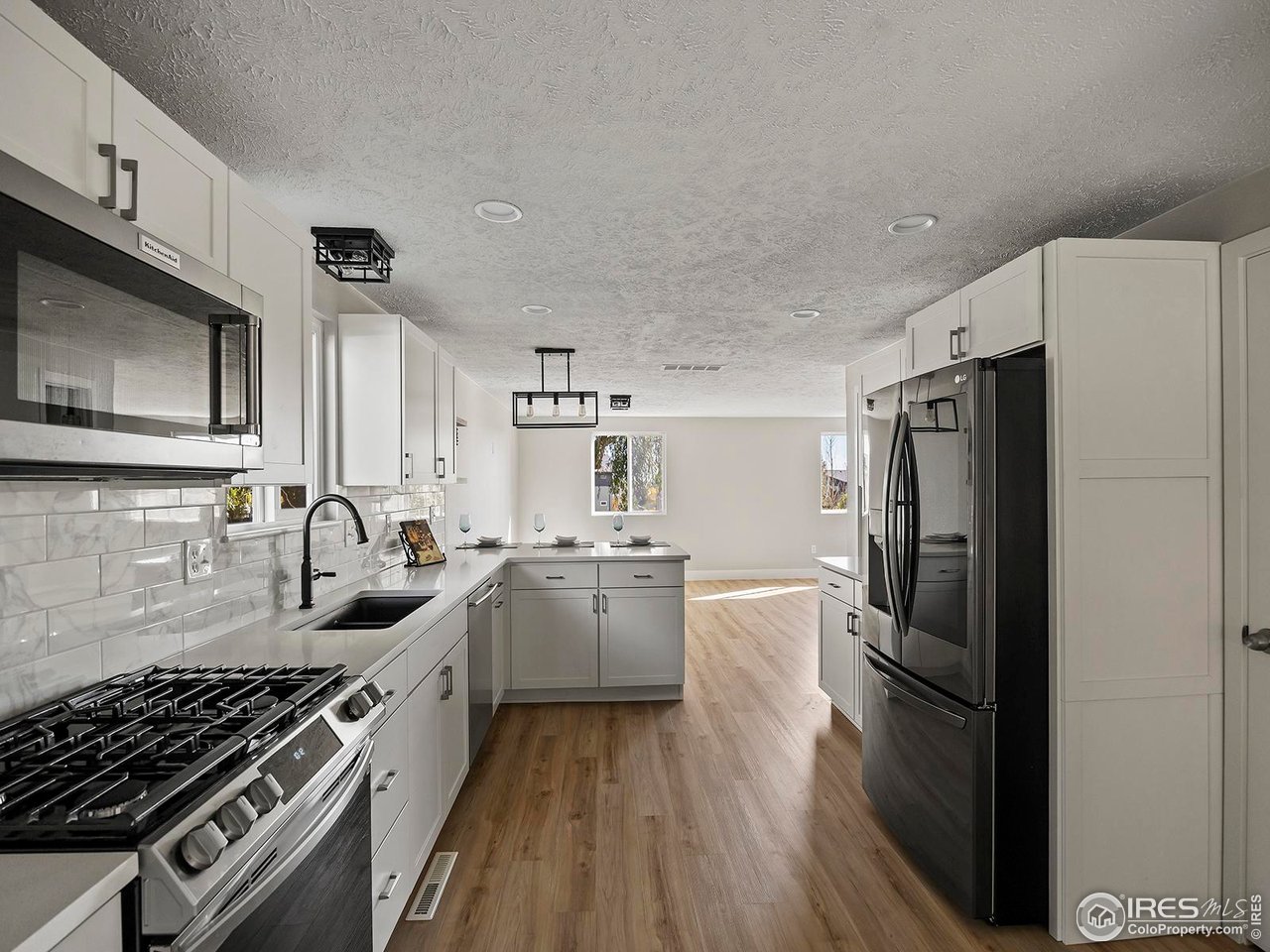 829 Independence Drive Longmont, CO 80504 - Photo 9 of 31 Kitchen features all new cabinets and appliances