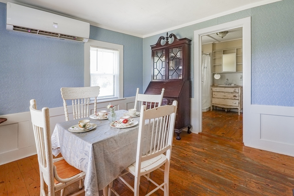 1255 Old Plainville Road New Bedford, MA 02745 - Photo 11 of 23 a view of a dining room with furniture window and wooden floor