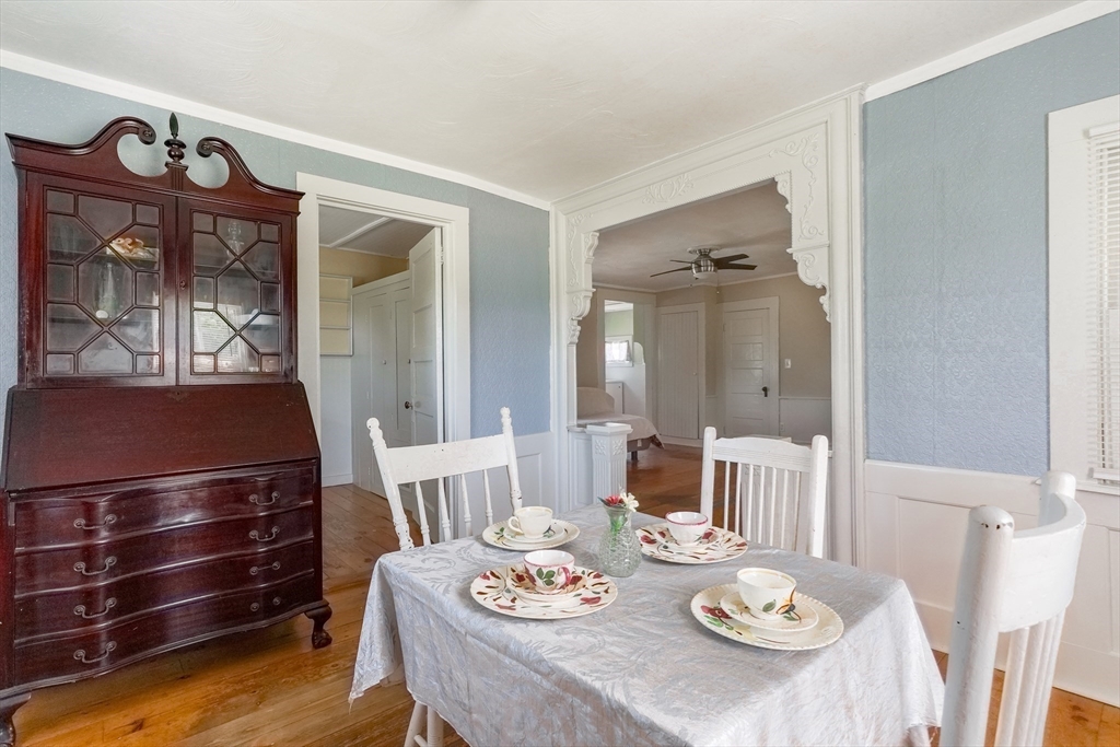 1255 Old Plainville Road New Bedford, MA 02745 - Photo 12 of 23 a view of a dining room with furniture a chandelier and wooden floor