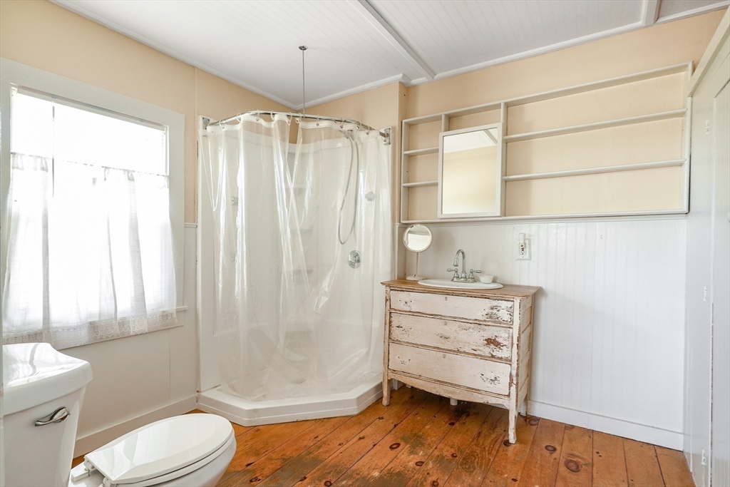 1255 Old Plainville Road New Bedford, MA 02745 - Photo 13 of 23 a bathroom with a granite countertop sink toilet and shower