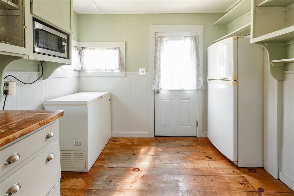 1255 Old Plainville Road New Bedford, MA 02745 - Photo 16 of 23 a view of a kitchen with sink and refrigerator
