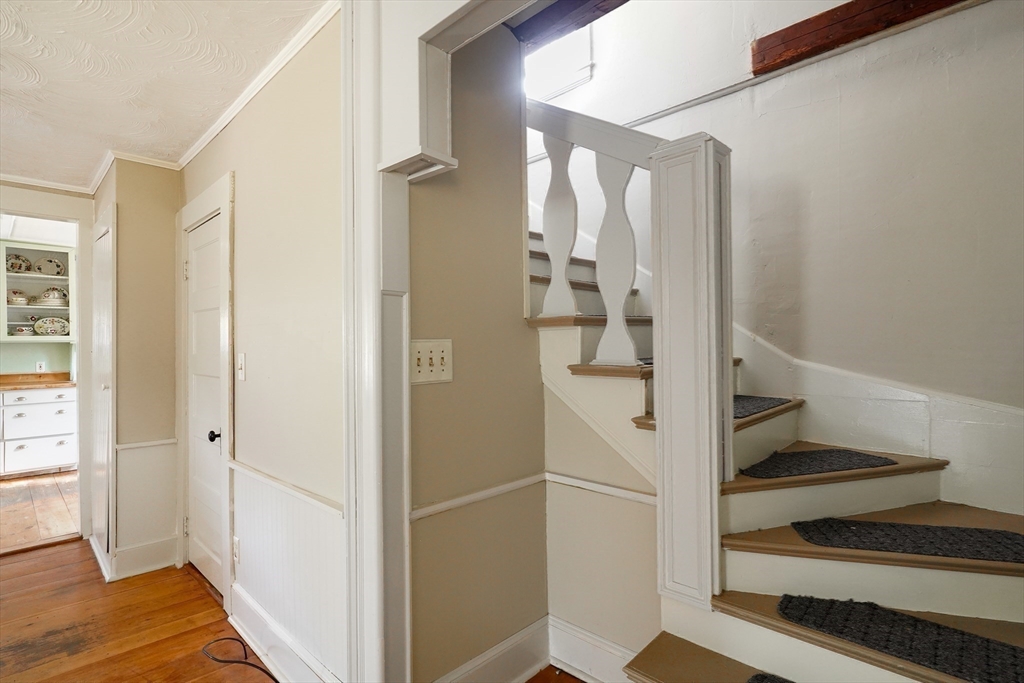 1255 Old Plainville Road New Bedford, MA 02745 - Photo 17 of 23 a view of entryway with wooden floor and staircase