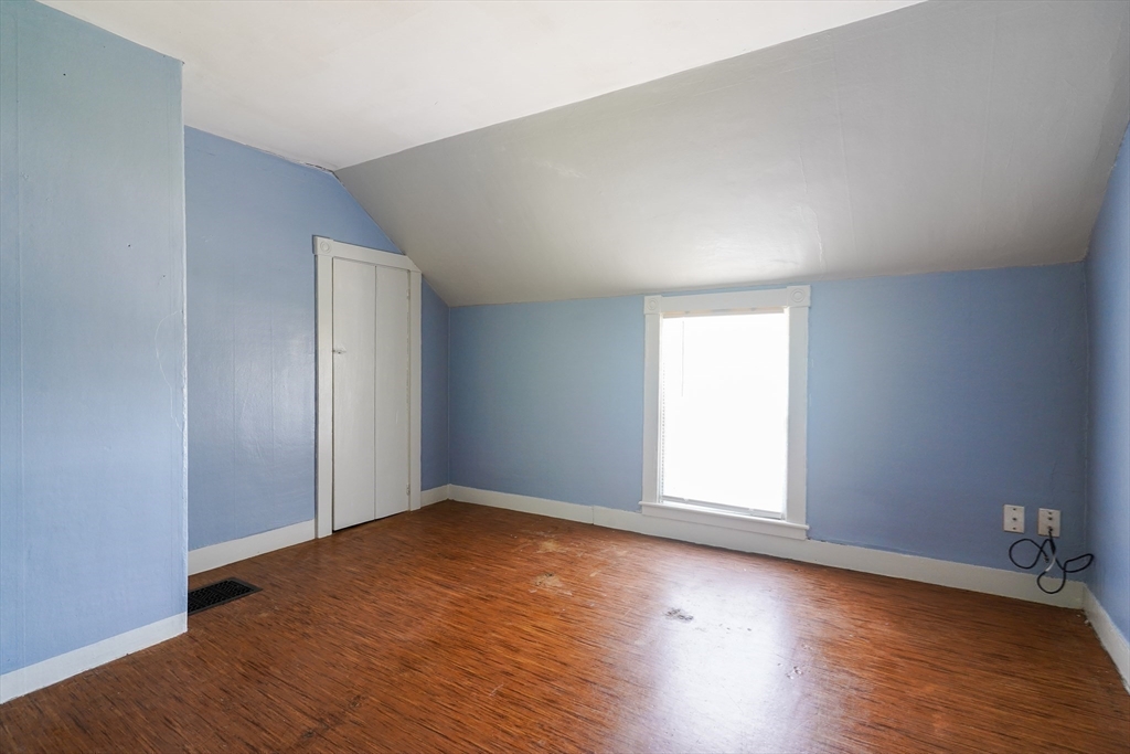 1255 Old Plainville Road New Bedford, MA 02745 - Photo 18 of 23 an empty room with wooden floor and windows